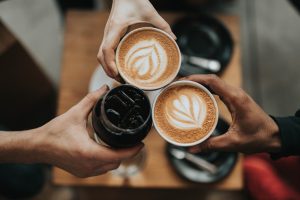 Image of hands holding coffee