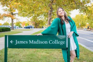 Portrait of a smiling person in a graduation gown