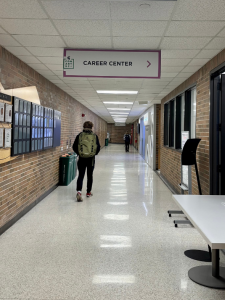signage in a hallway notifies people of the CAS Career Center