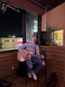 A person plays guitar