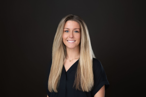 Portrait of a smiling person on a dark background