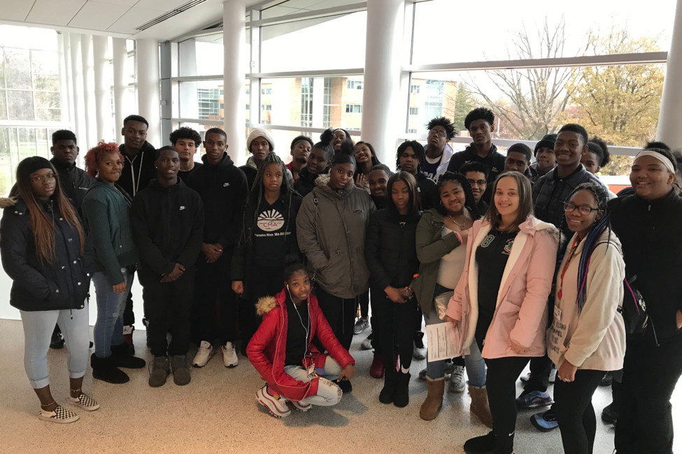 Many black young students posing for photos at Brody