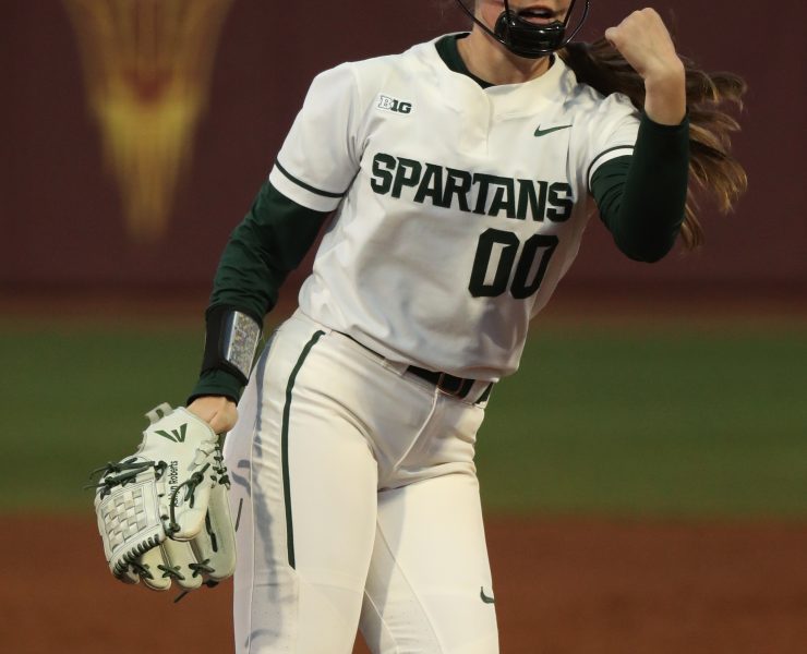 A picture of a woman on the Michigan State University softball team playing