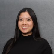 A student smiles for a portrait