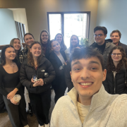 A plethora of students smiling on an agency tour