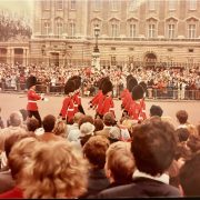 A crowd watches the British Royal Guards march