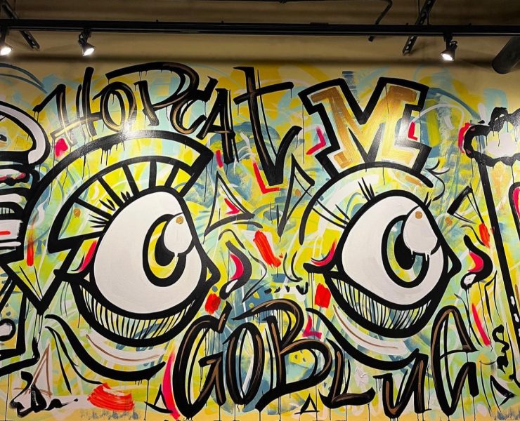 A hip-hop art-inspired mural inside a restaurant