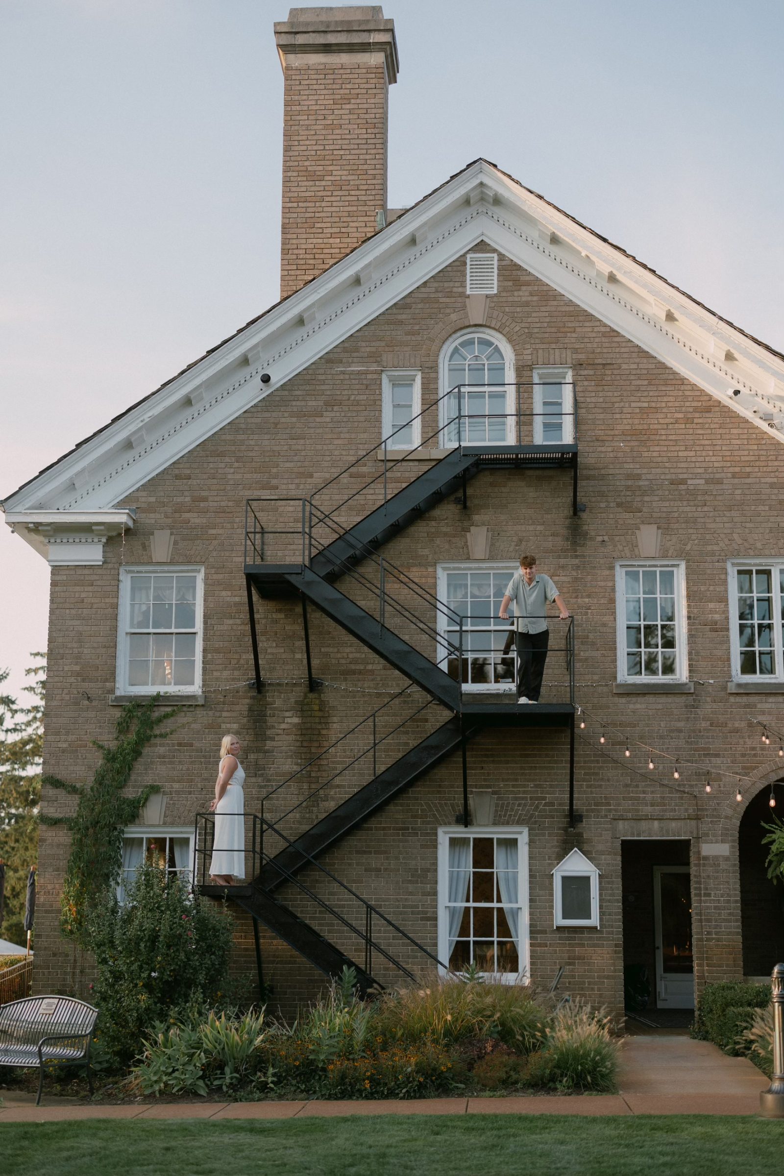 A photograph of a wedding engagement on the side of a building