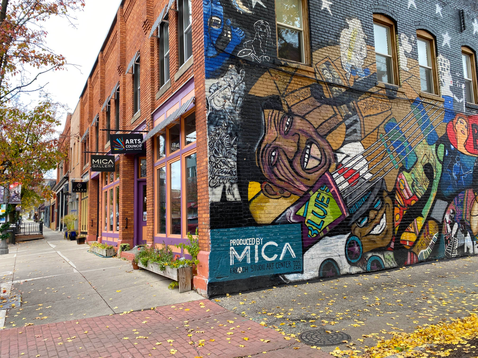 An exterior shot of a colorful mural on a street corner