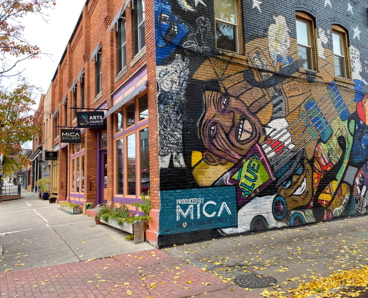 An exterior shot of a colorful mural on a street corner