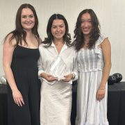 Three students pose for a picture.