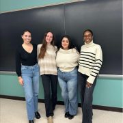 Four students smiling