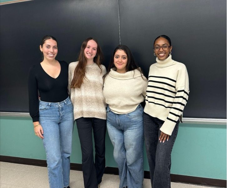 Four students smiling