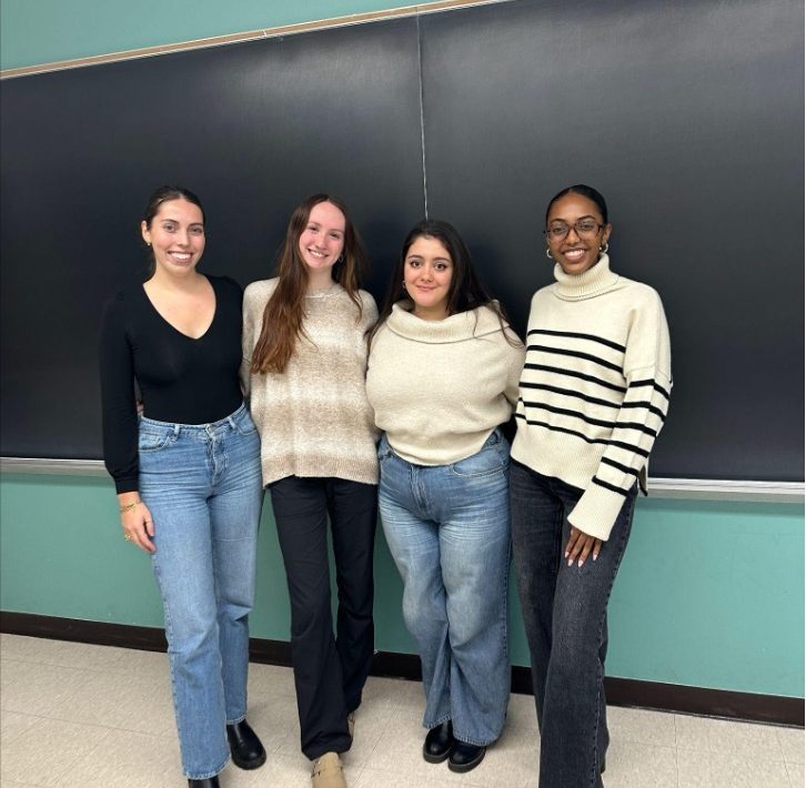 Four students smiling