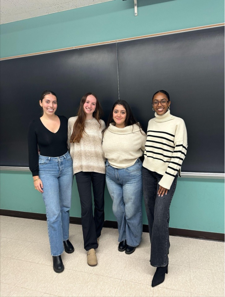 Four students smiling