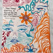 Handwritten, handcolored designs on a piece of paper