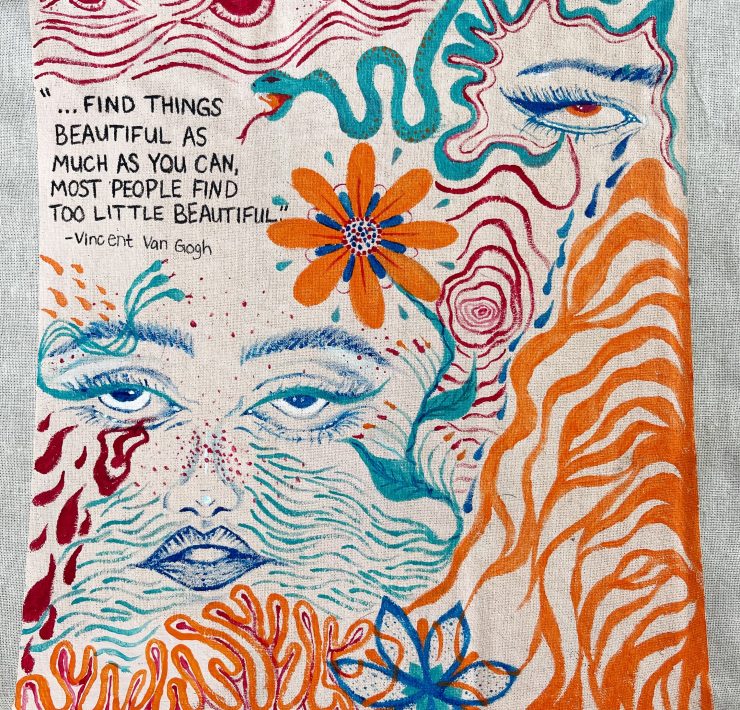 Handwritten, handcolored designs on a piece of paper