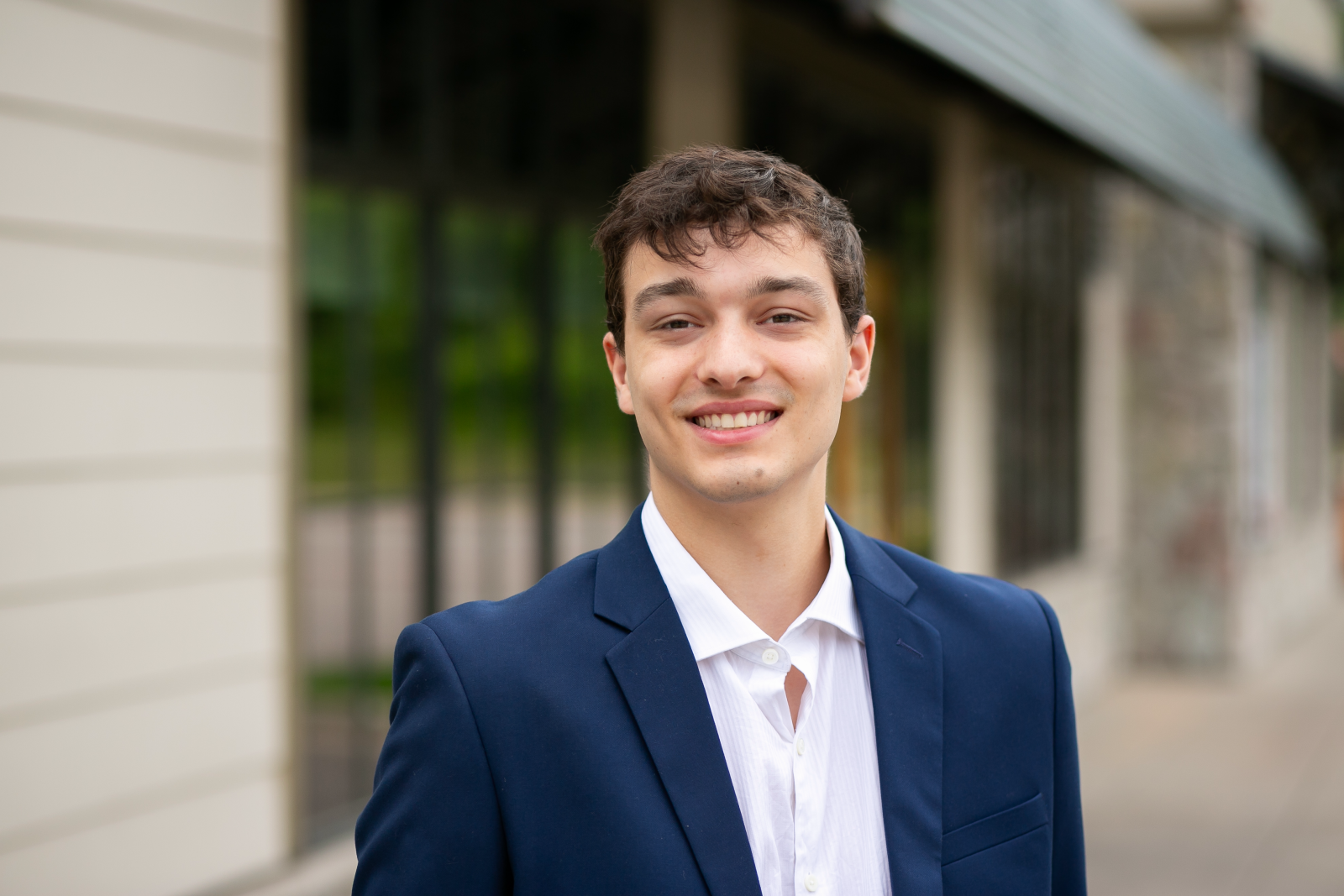 A professional portrait of a person smiling