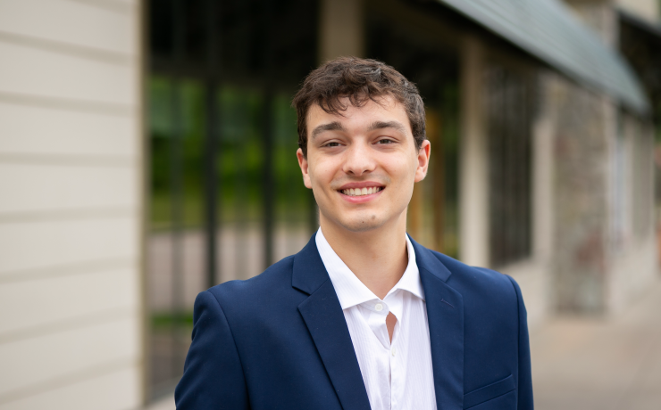 A professional portrait of a person smiling