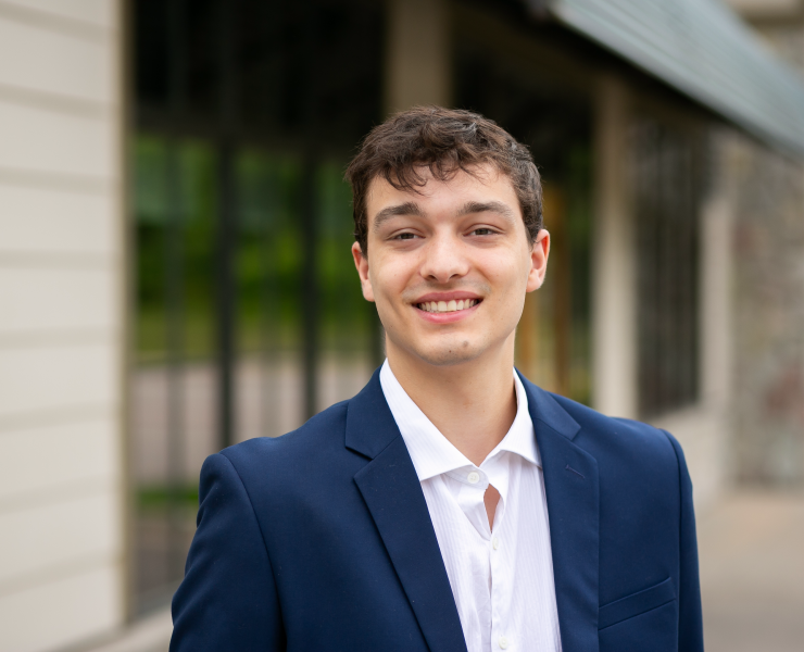 A professional portrait of a person smiling