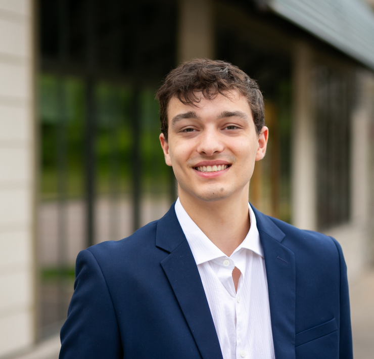 A professional portrait of a person smiling