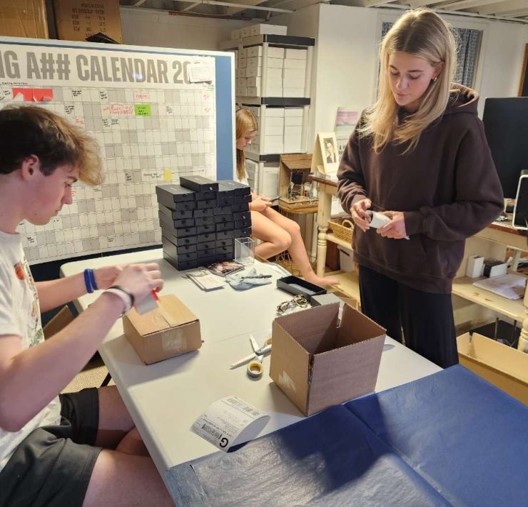 People work on an eyewear brand