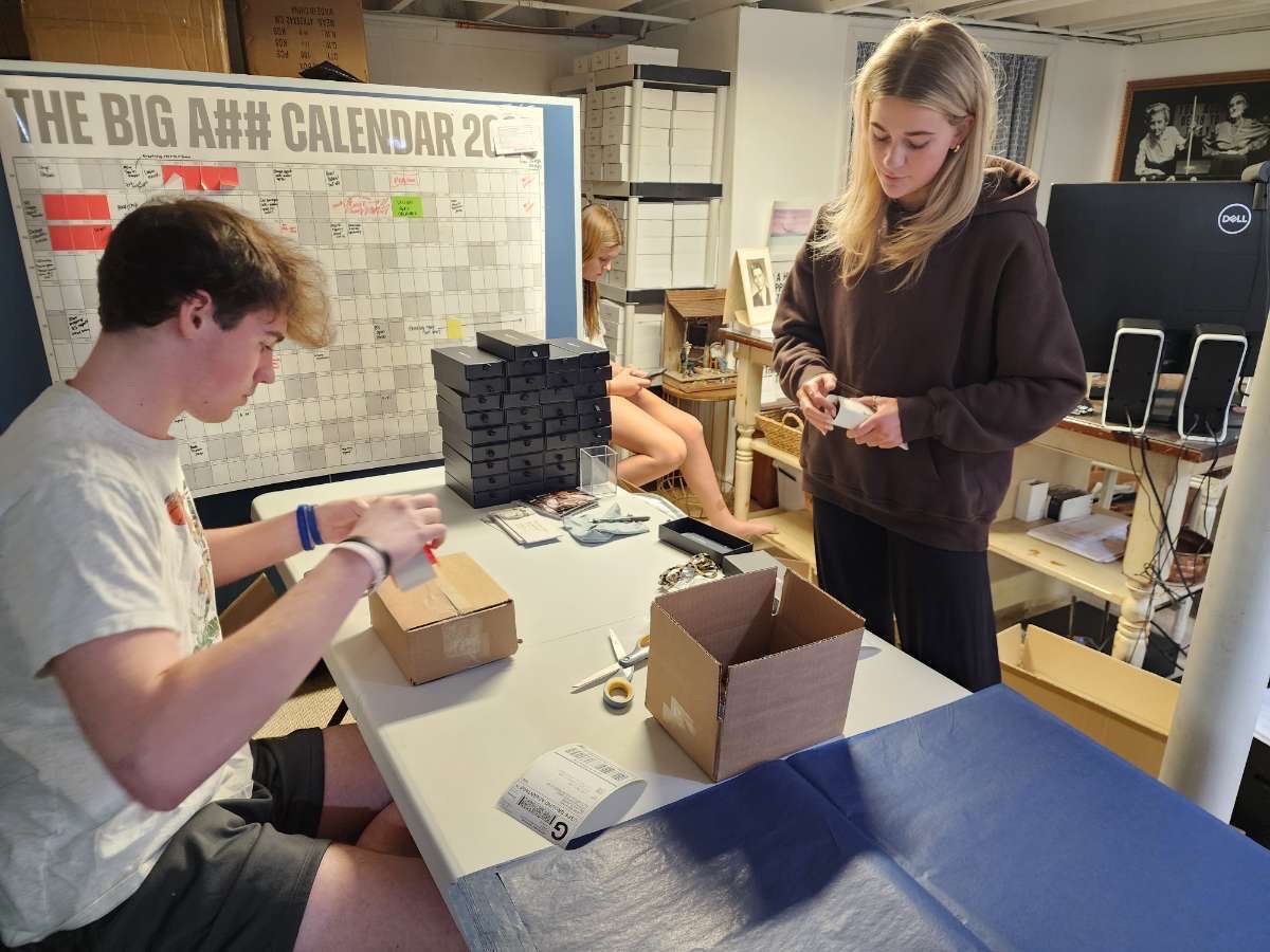 People work on an eyewear brand