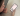 A person looks at a web app on a phone screen