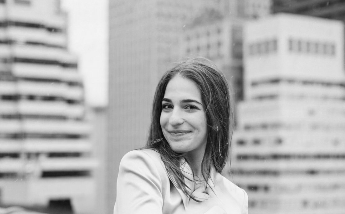 A portrait of a person outside