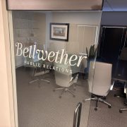 A logo printed on a glass door