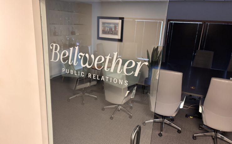 A logo printed on a glass door