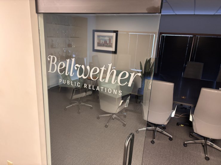 A logo printed on a glass door