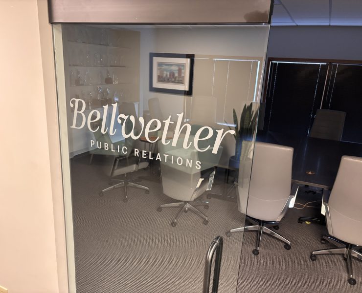 A logo printed on a glass door