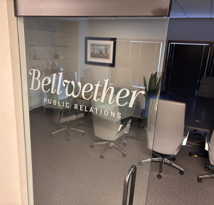 A logo printed on a glass door
