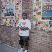 A person posing outside