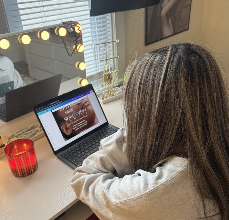 A person looks at a computer screen in a room
