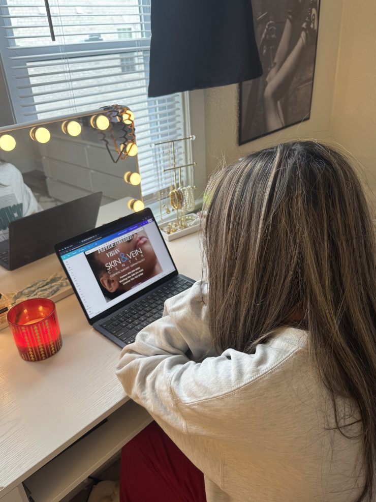 A person looks at a computer screen in a room