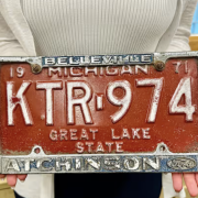 an old red orange license plate