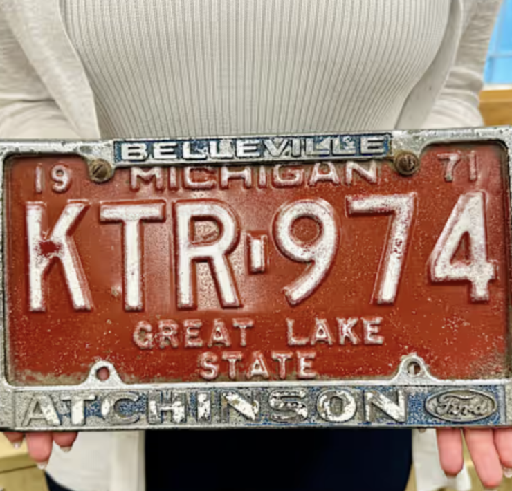 an old red orange license plate