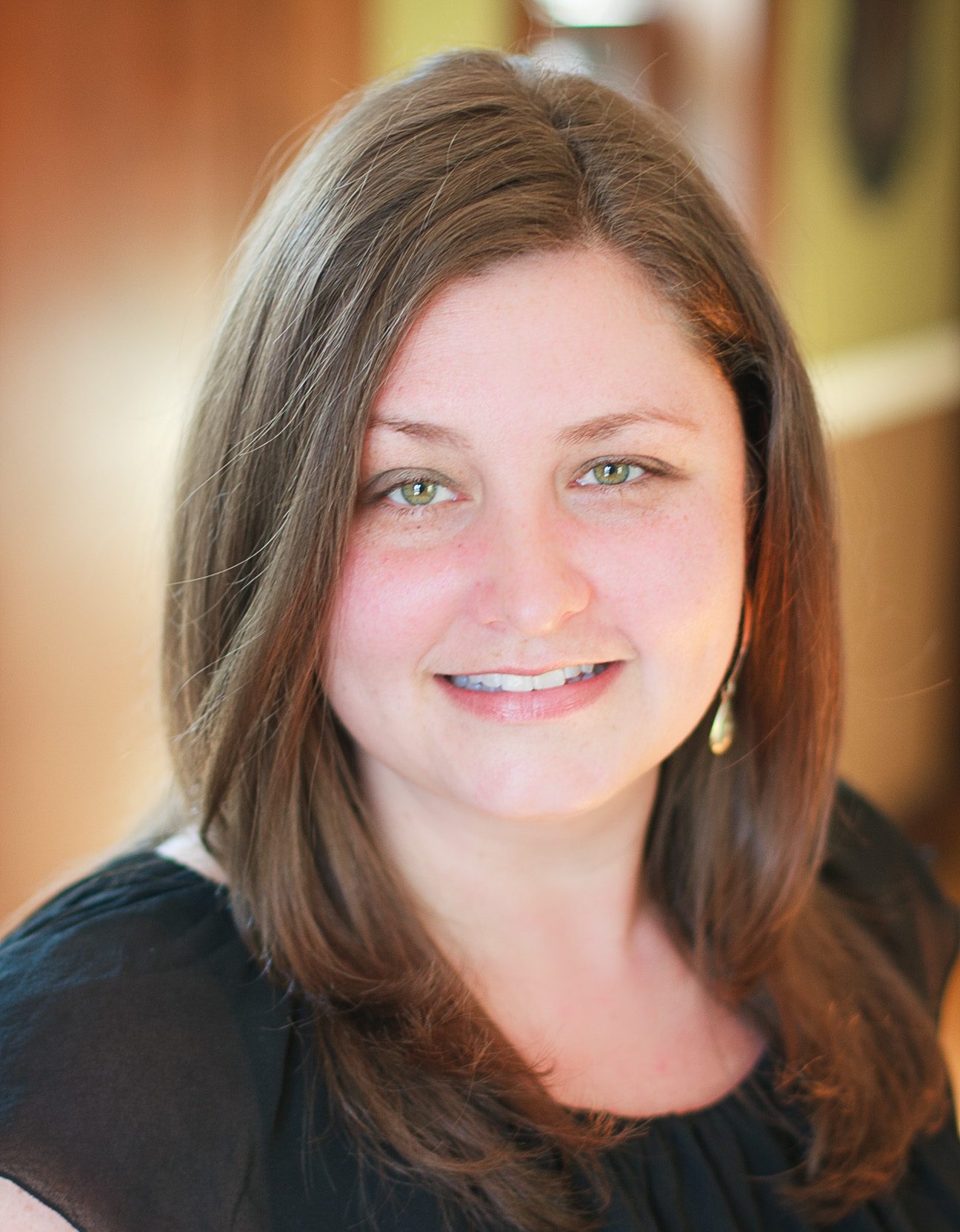 A portrait of a smiling faculty member