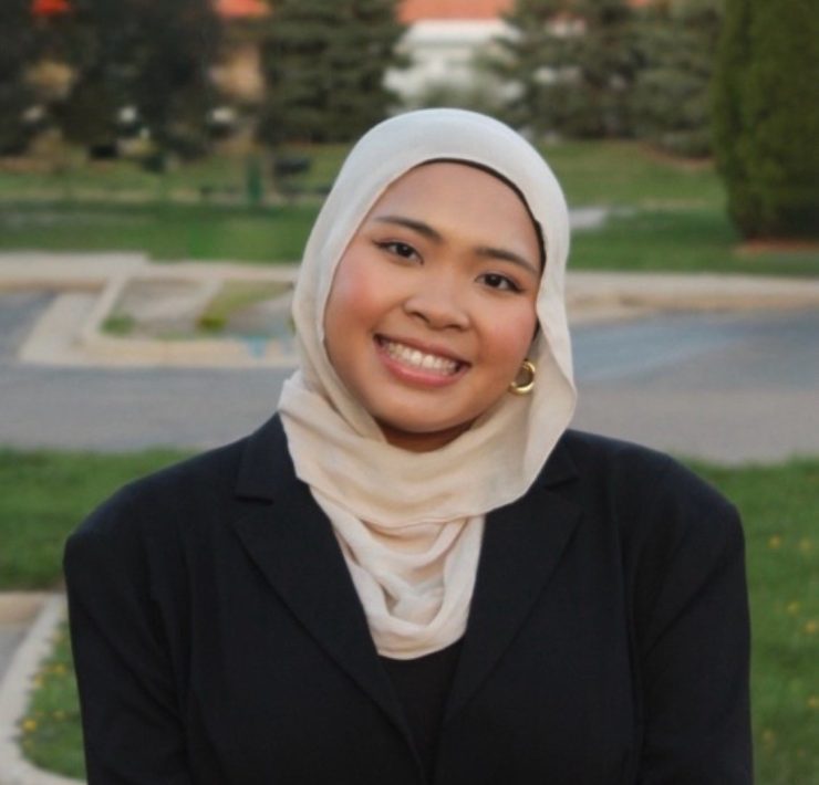 A person smiles for a portrait